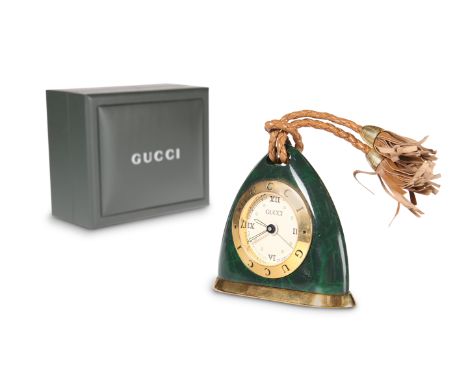 A GUCCI ALARM CLOCK, of triangular form, in a simulated malachite and gold coloured case, stamped to base GUCCI REGISTERED MO