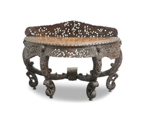 AN ANGLO-INDIAN HARDWOOD CONSOLE TABLE, 19TH CENTURY, demilune, profusely pierced and carved with animals, foliage and lion m