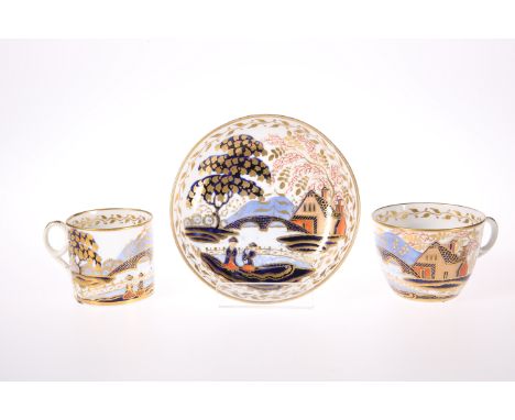 A NEW HALL TRIOComprising can, tea cup and saucer, decorated to pattern number 1154 with figures in a landscape in an Imari p