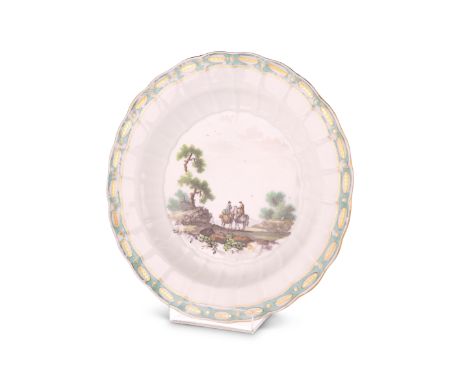 AN IMPORTANT NEW HALL PLATEby Fidelle Duvivier, c.1787-90With a corrugated border and shaped rim, the centre painted with fig