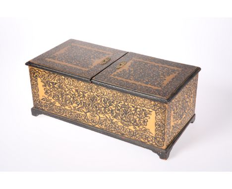 A LARGE 19TH CENTURY POKERWORK TEA CADDY, the twin flap top opening to a fitted interior, on bracket feet and decorated throu