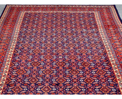 A QUM CARPET. 311cm by 220cm