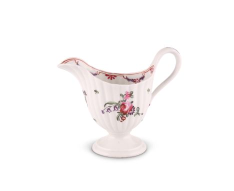A NEW HALL CREAM JUG, CIRCA 1782-90Fluted pedestal form, painted to pattern number 139 with swags and floral sprays, 10cm hig
