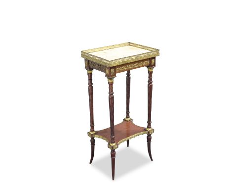 A FRENCH GILT-METAL MOUNTED AND ONYX TOPPED OCCASIONAL TABLE, the rectangular top with pierced gallery, raised on fluted-twis