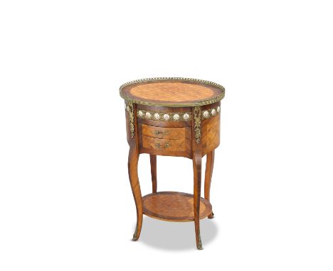 A FRENCH GILT-METAL AND PORCELAIN MOUNTED OCCASIONAL TABLE, the oval parquetry top with three-quarter pierced gallery, over a