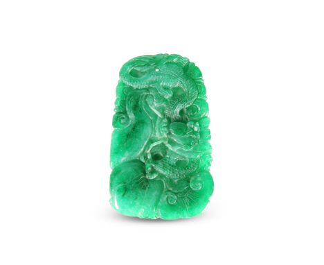 A CHINESE JADE PENDANT, rectangular, carved with dragon, bird and fruit. 9cm by 5.5cm