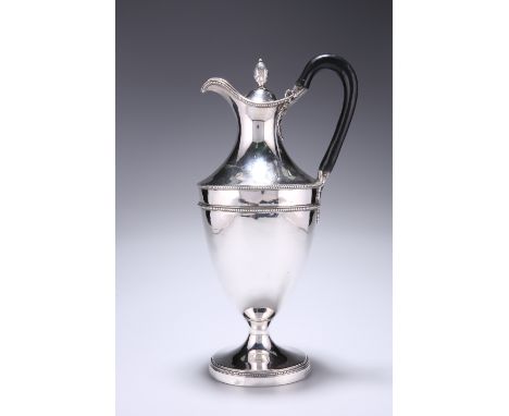 A GEORGE III SILVER CLARET JUG,&nbsp;by Hester Bateman, London 1779,&nbsp;urn-shaped, the plain body with beaded borders and 