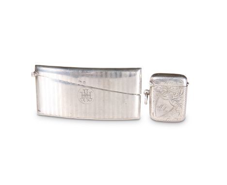 A LARGE GEORGE V SILVER VESTA, by E.J. Houlston, Birmingham 1912, shaped for the pocket, the engine-turned ground centred by 