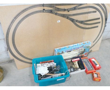 A collection of Hornby train and track: to include board, buildings, br pacer twin railbus (boxed), boxed smokey joe engine e