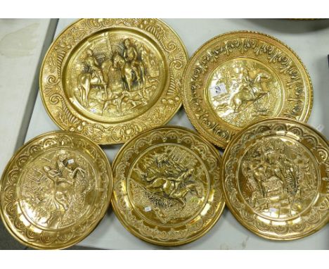 A Collection of Mid Century Brass Wall Plaques: with hunting scene's,  diameter of largest 37cm(5)