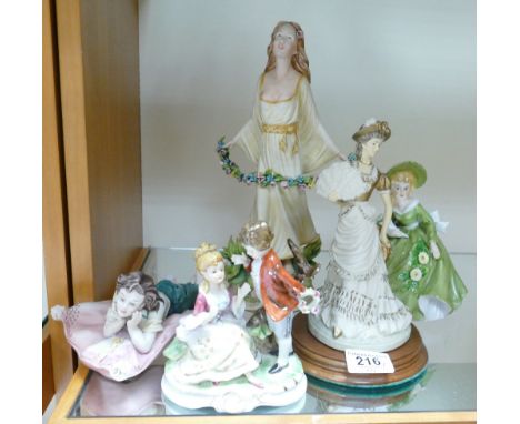 Mixed collection of items to include: ceramic and resin lady and child figures. (5)