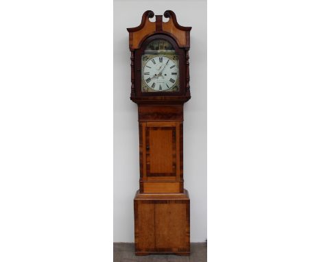 A 19th century oak and mahogany longcase clock, the hood with a broken swan neck pediment and turned columns, above a short t