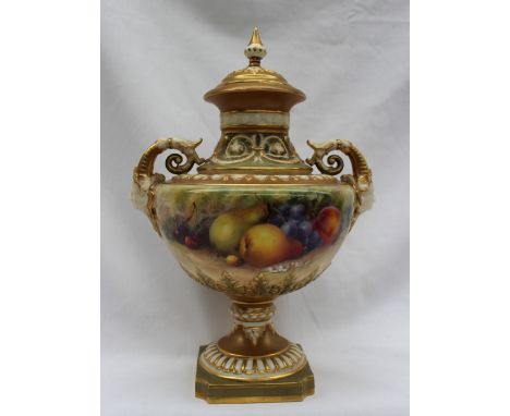 A Royal Worcester twin handled vase and cover, hand painted with apples, pears, cherries and grapes signed by Ricketts with t