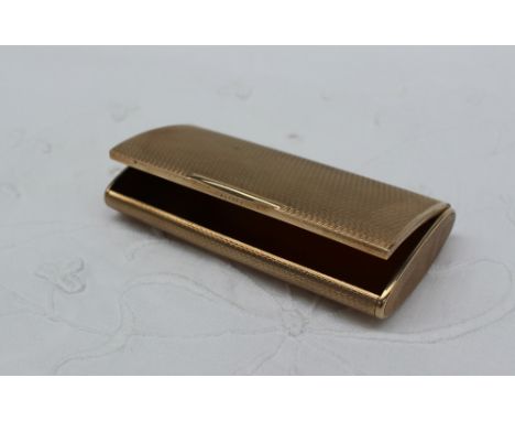A 9ct yellow gold snuff box of rectangular form with engine turned decoration, approximately 61 grams, 78mm x 40mm