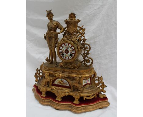 A 19th century gilt spelter mantle clock, with a centurion and shield with flowers and leaves the circular dial with Roman nu