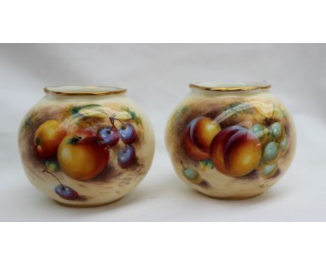 A pair of Royal Worcester vases of spherical form, one painted with apples and grapes, the other painted with peaches and gra
