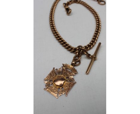 A 9ct yellow gold Albert chain, with twisted oval links, T bars and a 9ct yellow gold medallion, approximately 62 grams, 38cm