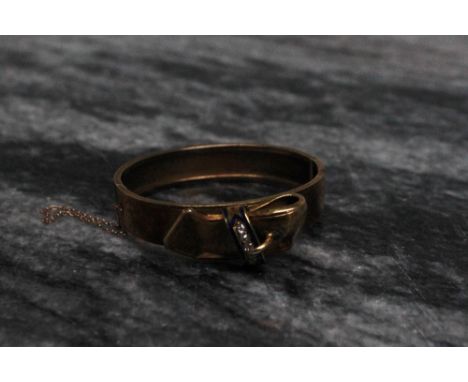 A yellow metal diamond and blue enamel set hinged bangle, of strap form, set with five oval diamonds, approximately 20 grams