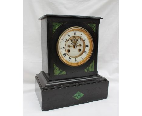 A 19th century black slate mantle clock, of rectangular form on a plinth, the circular dial with Roman numerals and an insigh