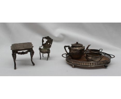 An Edward VII silver miniature tea set, comprising a teapot, cream jug, sugar basin and twin handled tray, Birmingham, 1905, 