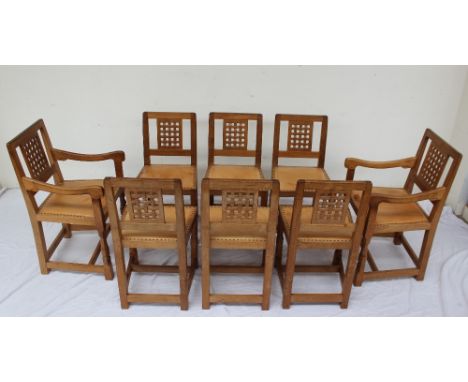 Robert Thompson of Kilburn, "Mouseman" - A set of eight light oak dining chairs with lattice back and studded seat on carved 