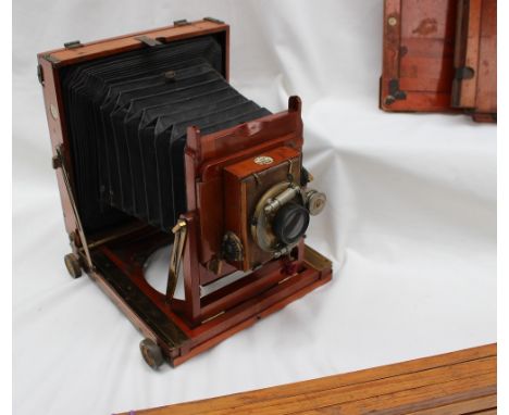 A Thornton Pickard triple imperial extension camera 24.5cm high x 21cm wide together with two plates and a  tripod