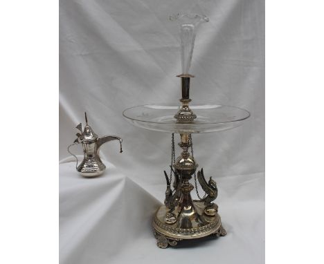 An electroplated table centrepiece with an engraved glass trumpet above a shallow glass dish, the base with winged birds with