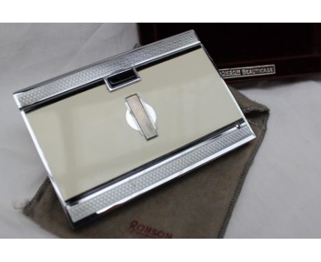 A Ronson Beauticare combination cigarette case and lighter, with enamel decoration in original sleeve and box, 10.5 x 7cm