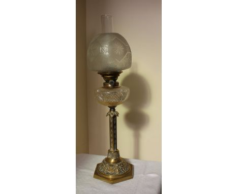 A Victorian cut glass oil lamp, the flared glass shade above a cut glass reservoir and brass column and spreading foot, 53cm 