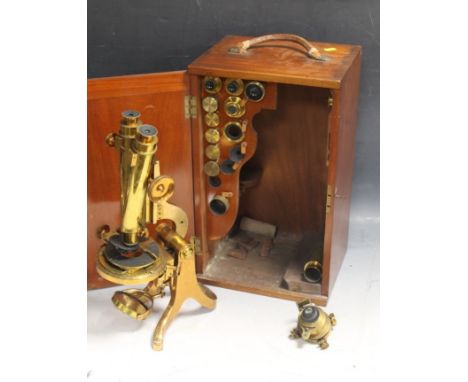 A 19TH CENTURY LACQUERED BRASS BINOCULAR MICROSCOPE, by Henry Crouch, numbered 4621. In fitted case with various extra lens. 