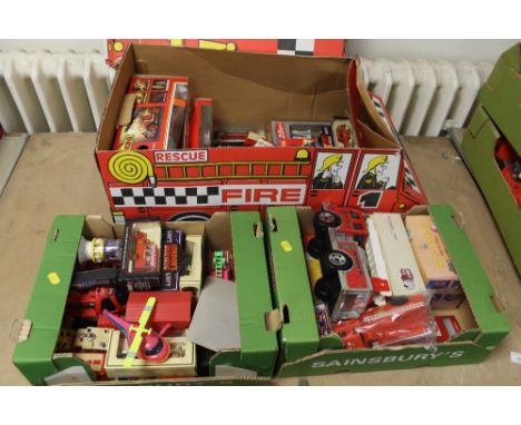 THREE BOXES OF FIRE ENGINE RELATED TOYS, to include Matchbox, Lledo, Corgi, etc. Including a cardboard designed Fire Engine b