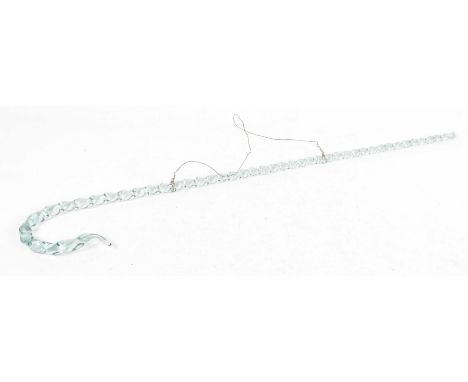 An early 20th Century glass walking stick
The decorative turned and blown glass stick with spiral twist design and green glas