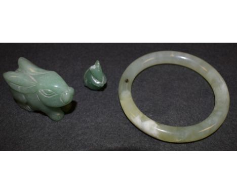 Stone - a polished jade apple green bangle; a carved rabbit and mouse (3)