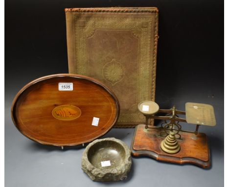 An Edwardian mahogany oval card tray, the centre inlaid with a shell patera, shaped gallery; a pair of mahogany and brass pos