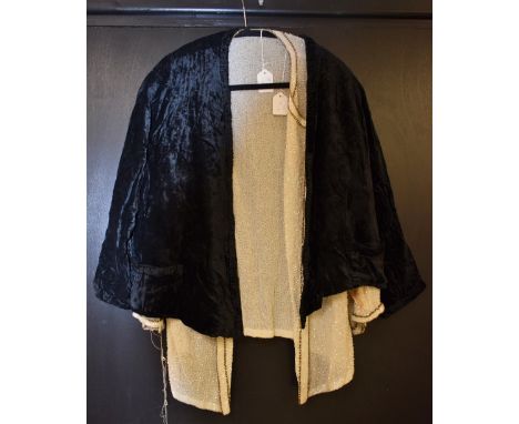 A 1920s beaded evening jacket, off white, white and brown bugle beading; a black crushed velvet jacket, long sleeves (2)