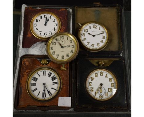 A leather cased travelling clock; four others (5)