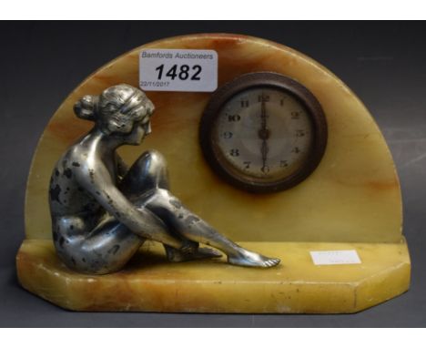 An eight-day Art Deco marble mantel clock, mounted with silvered lady