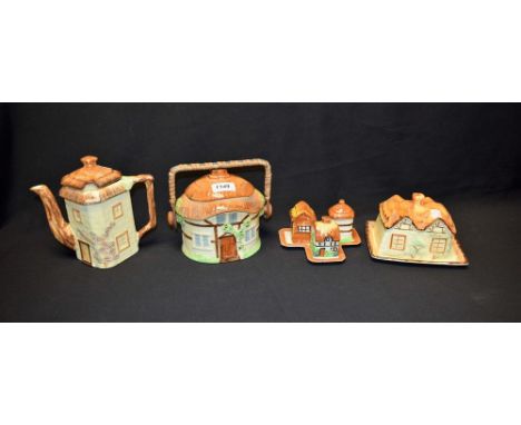 A Cottageware biscuit barrel, cheese dish, teapot and cruet