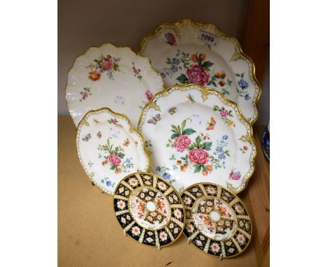 A set of three graduated Royal Crown Derby Derby Days pattern plates; a pair of 2451 pattern coffee can saucers; etc (6) 