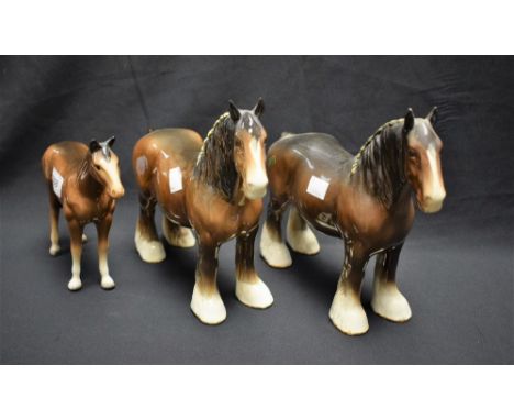 A Beswick model, of a shire horse, standing, four square, 27cm long, printed mark; another, similar; a Melba Ware horse (3)