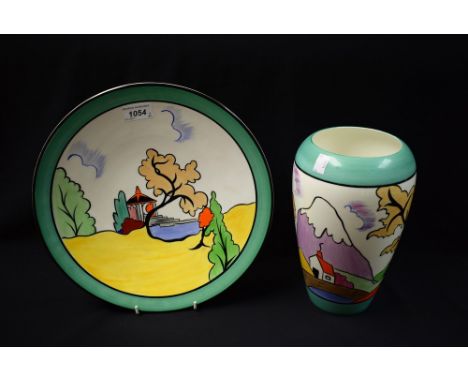 Pauline Tomkinson - a shaped baluster vase, painted in the manner of Clarice Cliff, with a Cottage and snow capped mountain, 