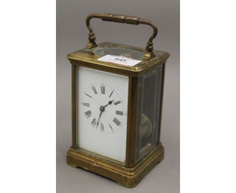 A brass cased carriage clock. 17 cm high.