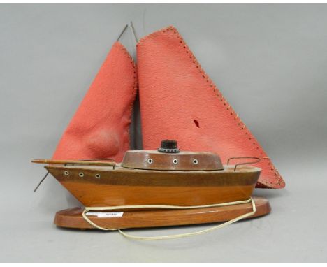 A vintage boat form lamp. 