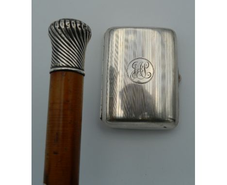 A silver topped walking stick and a silver cigarette case. The walking stick 89 cm long.