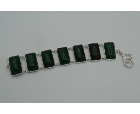 A silver and jade bracelet. 15 cm long.