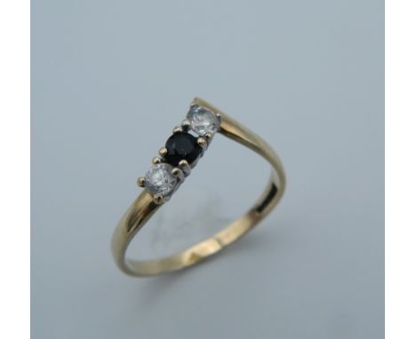 A 9 ct gold diamond and sapphire wishbone ring. Ring size M (1.3 grammes total weight)