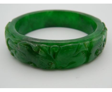 An apple green jade bangle. 7.5 cm diameter.