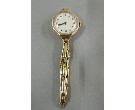A vintage ladies 9 ct gold Swiss made watch on a 9 ct gold bracelet (14.3 grammes total weight)