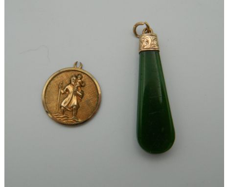 An Edwardian engraved rose gold and jade pendant, together with a St. Christopher pendant. The former 4 cm high.