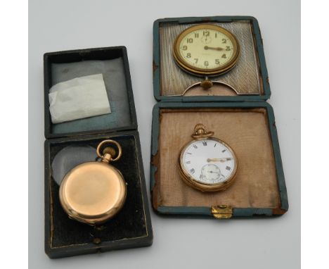 Two gold plated pocket watches and a travelling clock set in a silver frame. The latter 9 cm wide.